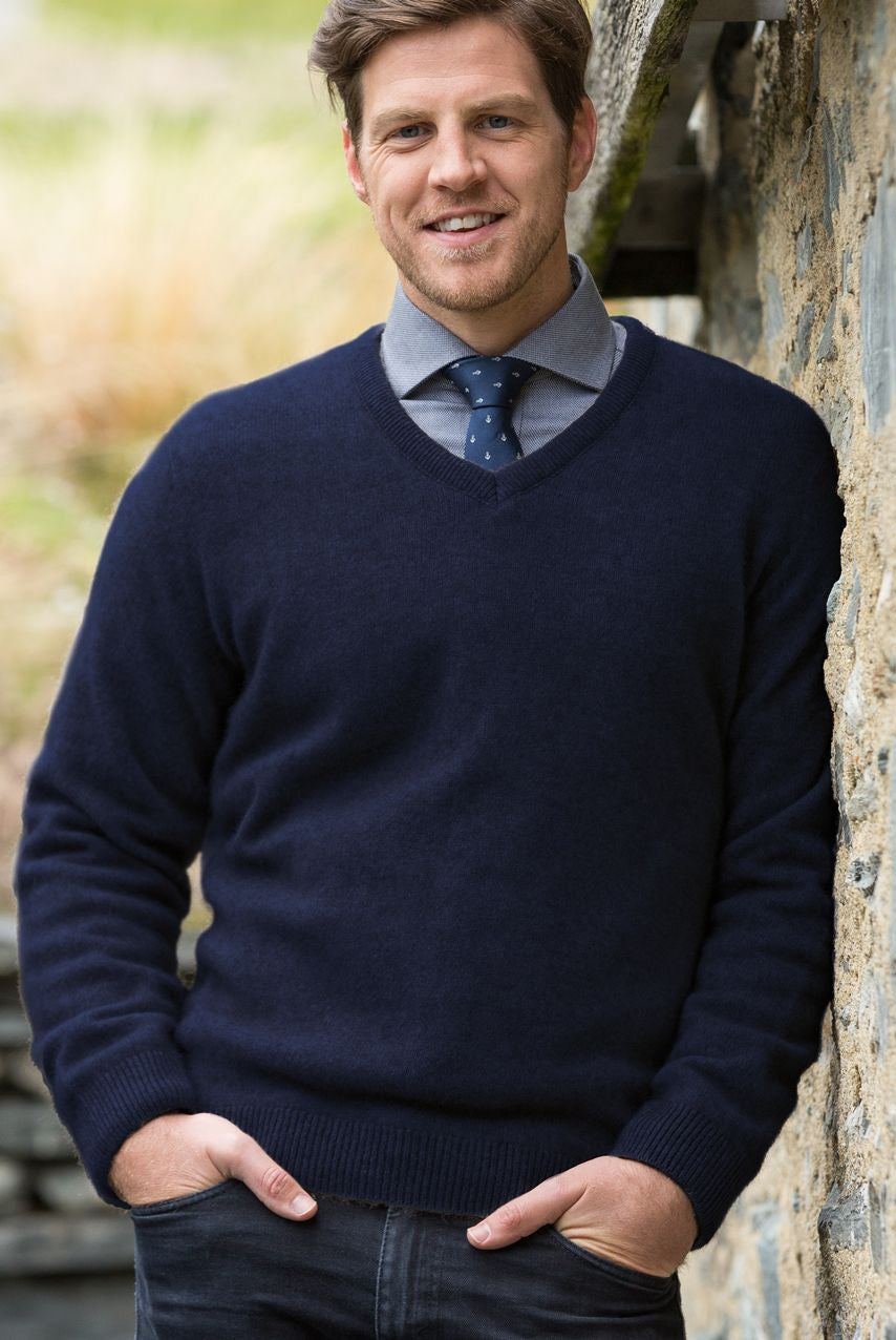 Man wearing the Noble Wilde - Merino & Possum Oxford Vee Sweater (NW1002) in the colour Maritime.