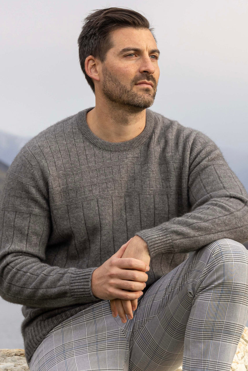 Man wearing Noble Wilde - Merino & Possum Riverton Sweater (NW1101) in the colour Shale.