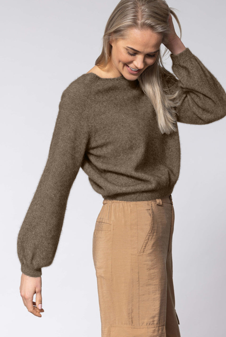 Woman wearing Noble Wilde - Merino & Possum Bellow Sleeve Top in the colour Latte.