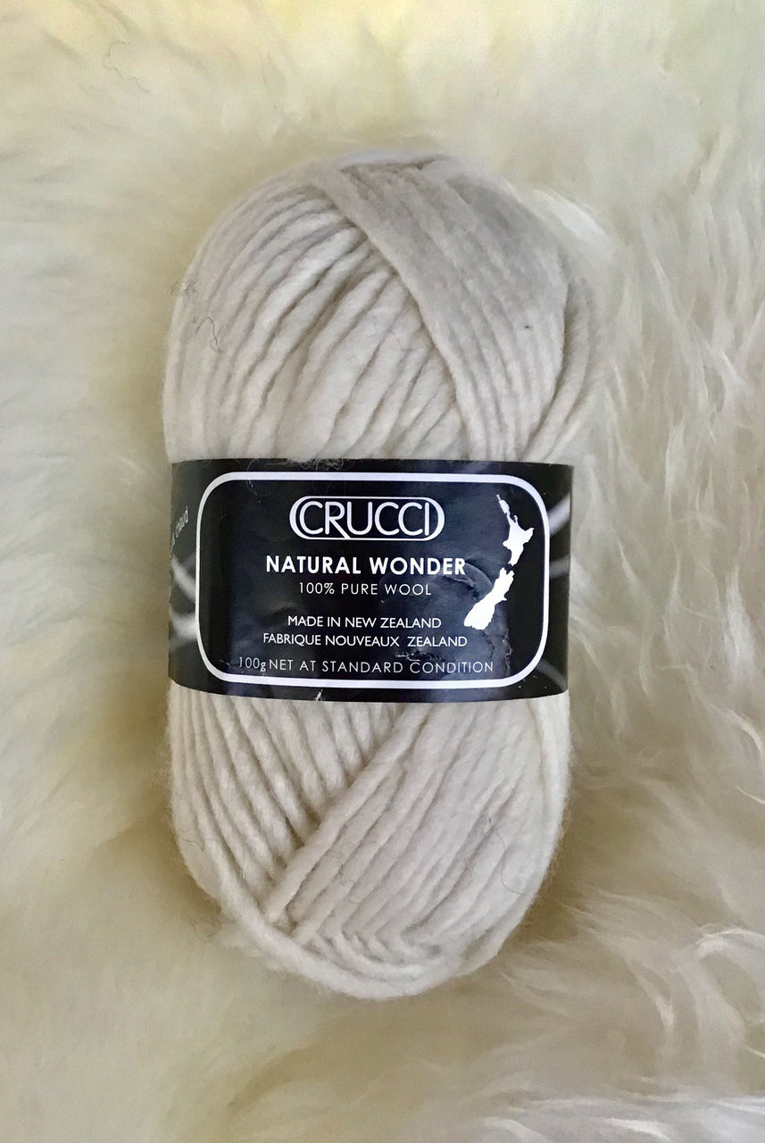 Ball of yarn in colour cream.