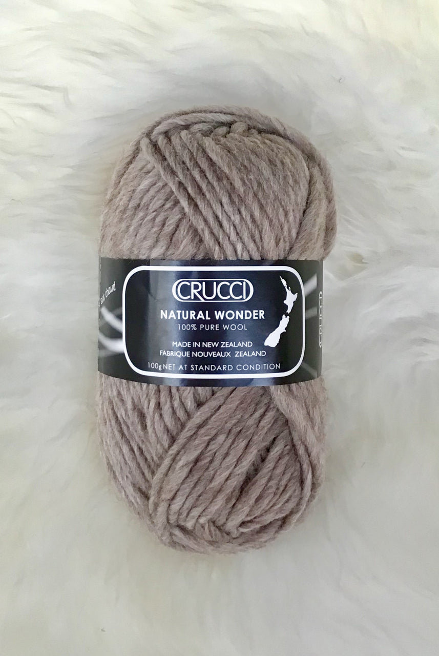 Ball of yarn in colour light brown.