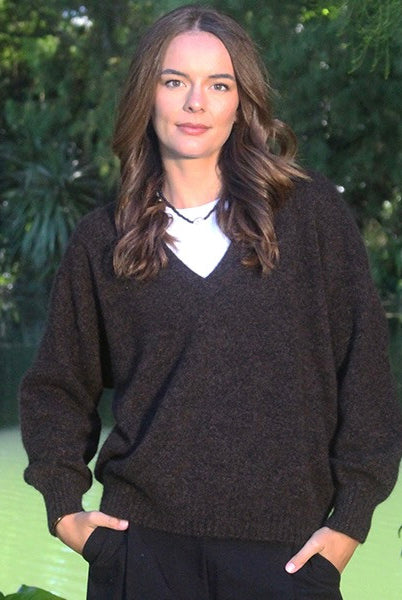 Woman wearing the Lothlorian - Merino & Possum Cavern V Neck Jumper (9789) in the colour Brown Marl.