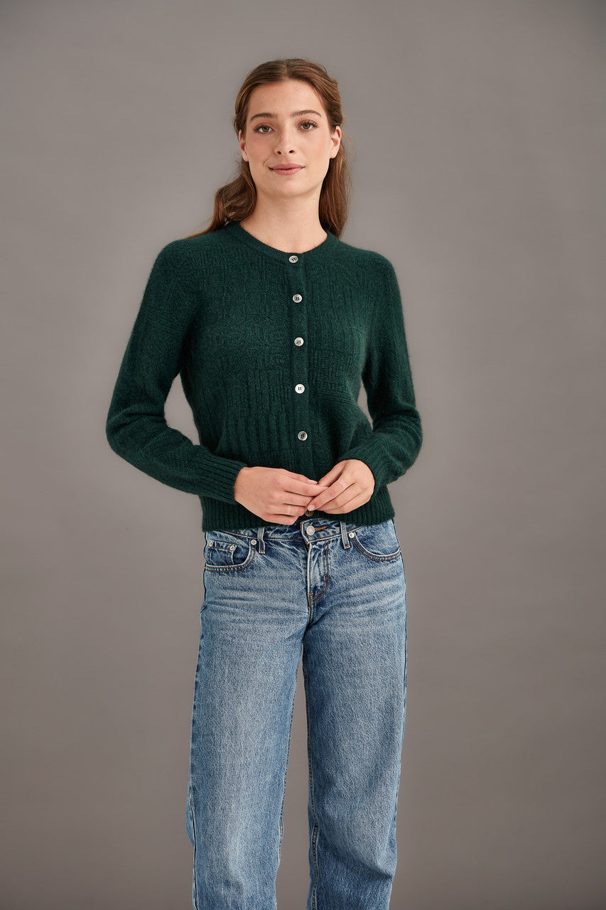 Woman wearing McDonald - Merino & Possum Patchwork Cardigan (5062) in the colour Forest.