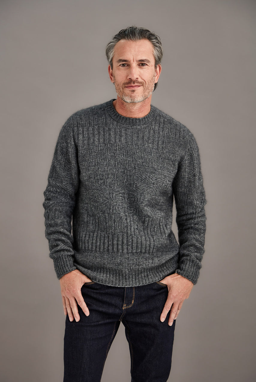 Man wearing McDonald - Merino & Possum Patchwork Sweater (6641) in the colour Pewter