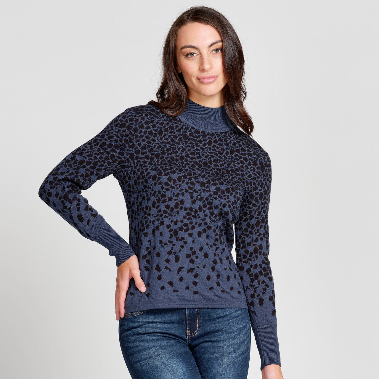 Woman wearing top in Teal/Black.