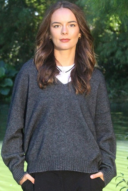 Woman wearing the Lothlorian - Merino & Possum Cavern V Neck Jumper (9789) in the colour Charcoal.