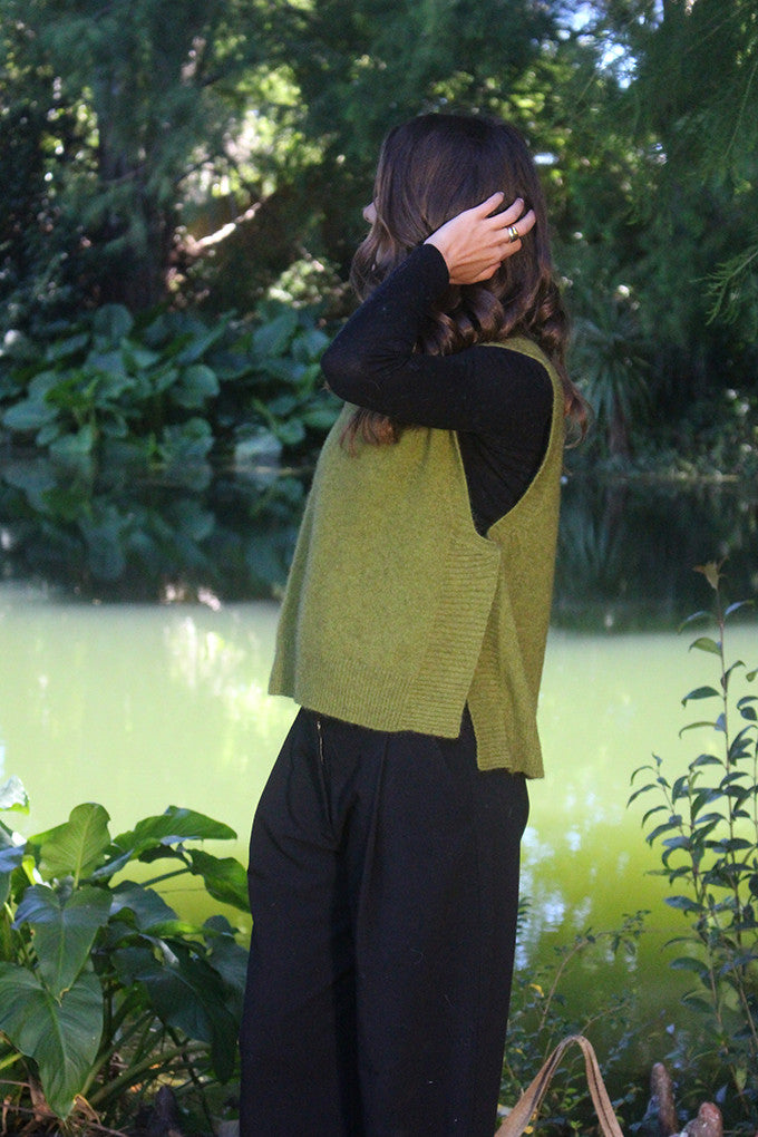 Woman wearing the Lothlorian - Merino & Possum Ride Vest (9650) in the colour Olive.