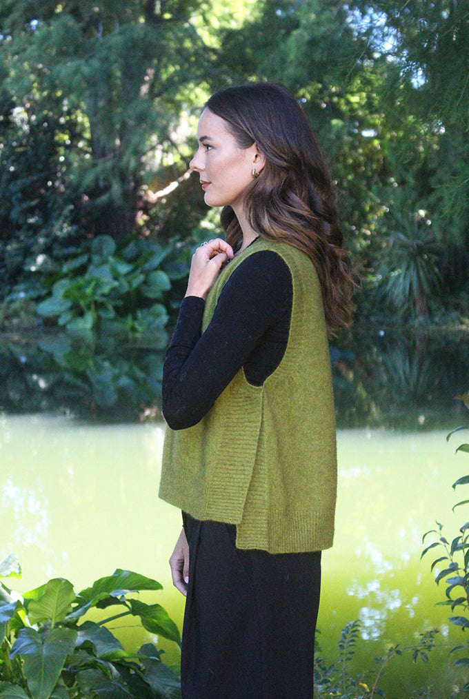 Woman wearing the Lothlorian - Merino & Possum Ride Vest (9650) in the colour Olive.