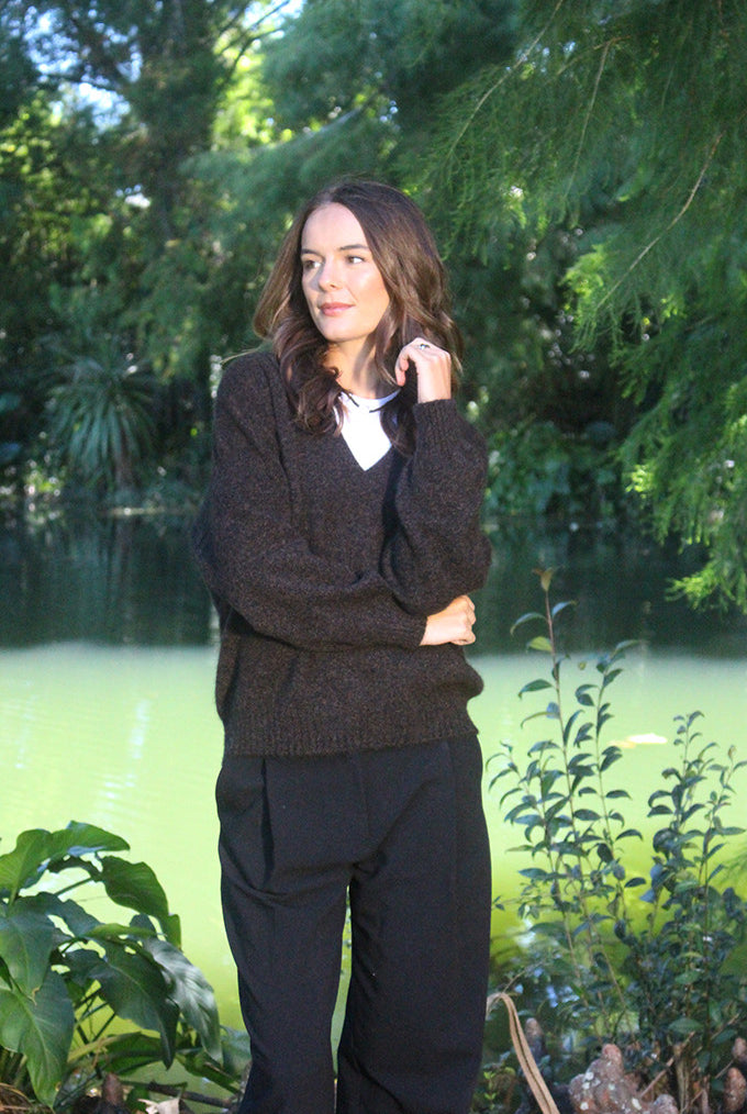 Woman wearing the Lothlorian - Merino & Possum Cavern V Neck Jumper (9789) in the colour Brown Marl.