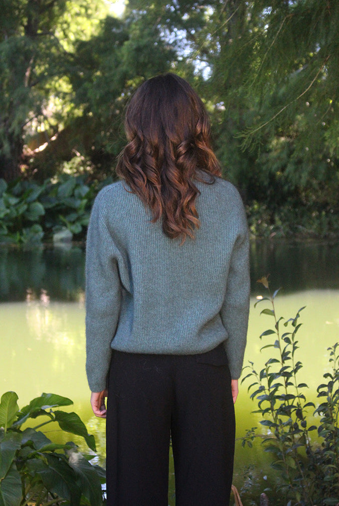 Woman wearing the Lothlorian - Merino & Possum Fuse Tie Jacket (9972) in the colour Sage.
