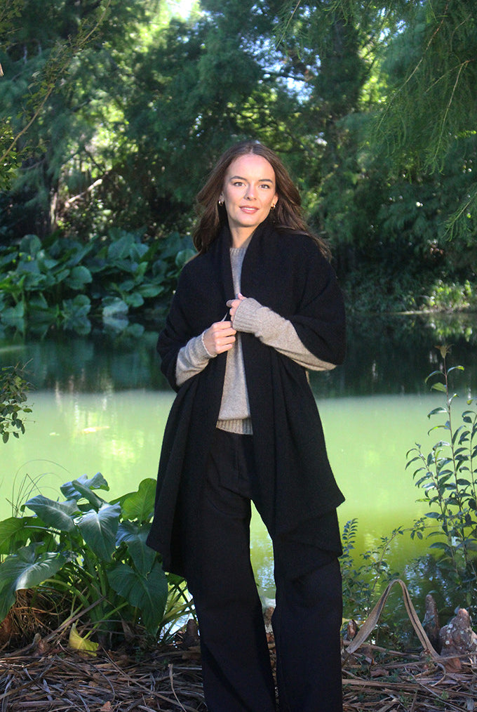 Woman wearing Lothlorian - Merino & Possum Brando Wrap (9993) in the colour Black.