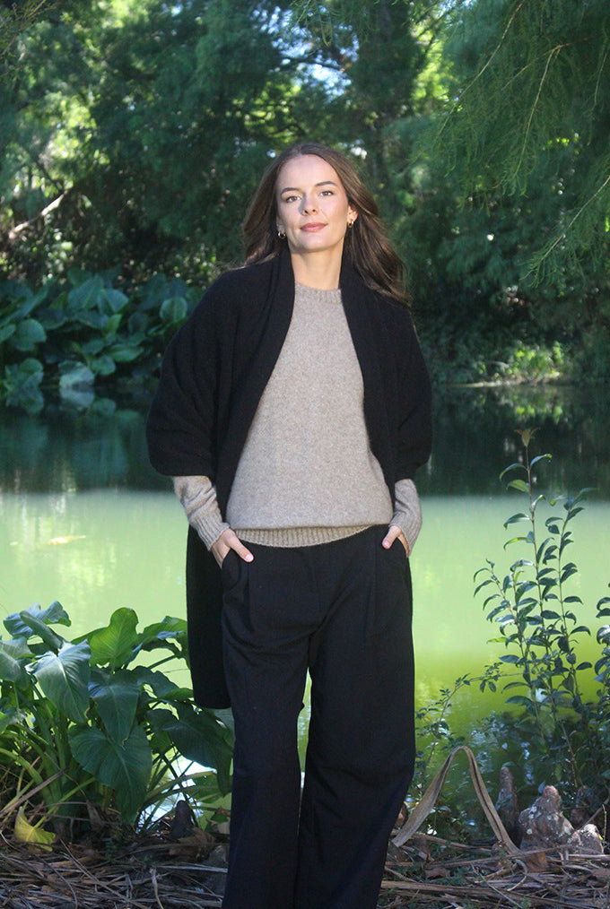 Woman wearing Lothlorian - Merino & Possum Brando Wrap (9993) in the colour Black.