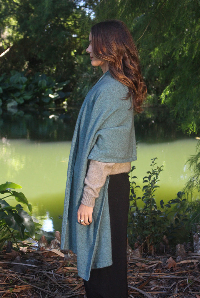 Woman wearing Lothlorian - Merino & Possum Brando Wrap (9993) in the colour Sage.