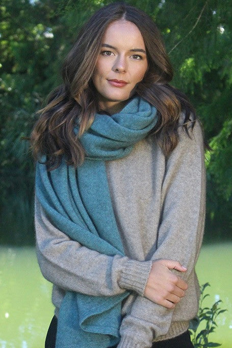 Woman wearing Lothlorian - Merino & Possum Brando Wrap (9993) in the colour Sage.