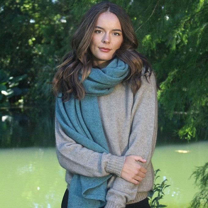 Woman wearing Lothlorian - Merino & Possum Brando Wrap (9993) in the colour Sage.