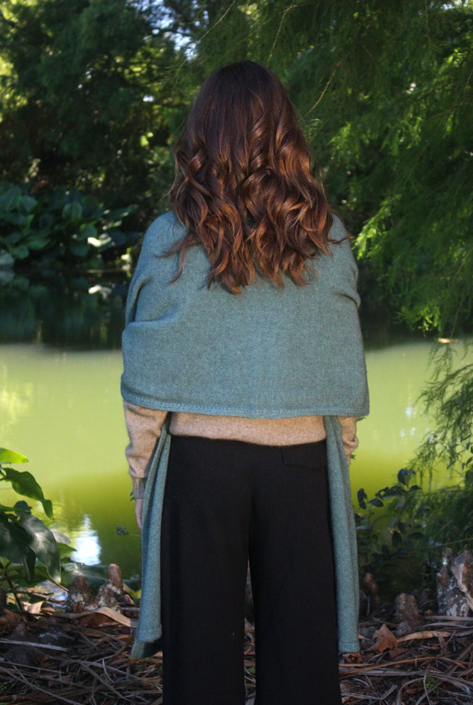 Woman wearing Lothlorian - Merino & Possum Brando Wrap (9993) in the colour Sage.