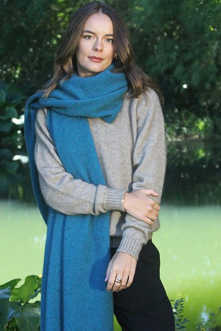 Woman wearing Lothlorian - Merino & Possum Brando Wrap (9993) in the colour Teal.
