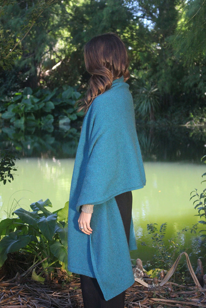 Woman wearing Lothlorian - Merino & Possum Brando Wrap (9993) in the colour Teal.
