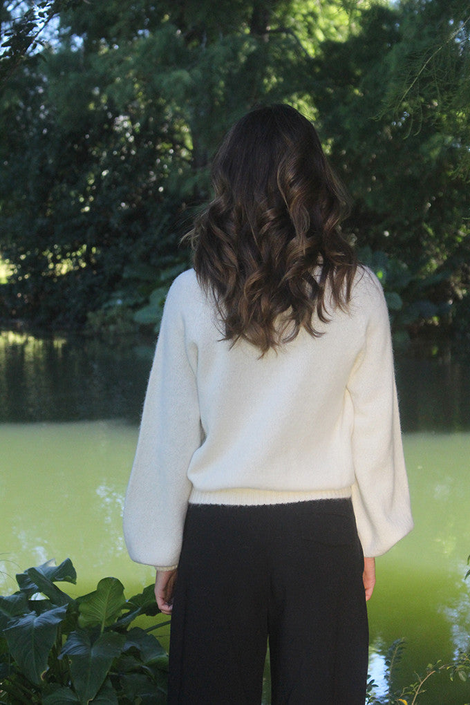 Woman wearing the Lothlorian - Alpaca Chime Jumper (ALP079) in the colour Natural.