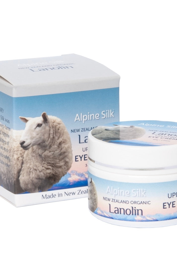 White 30gr pot of eye creme. Next to blue and white box packaging.
