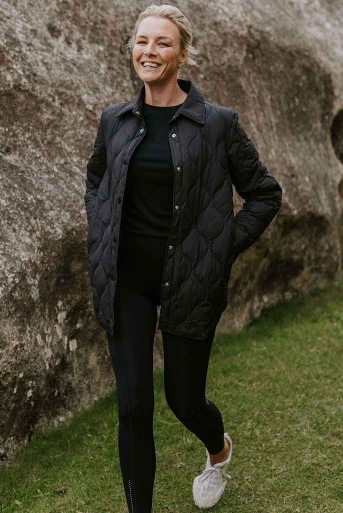Woman wearing Moke - Ash Down Overshirt in the colour Black.