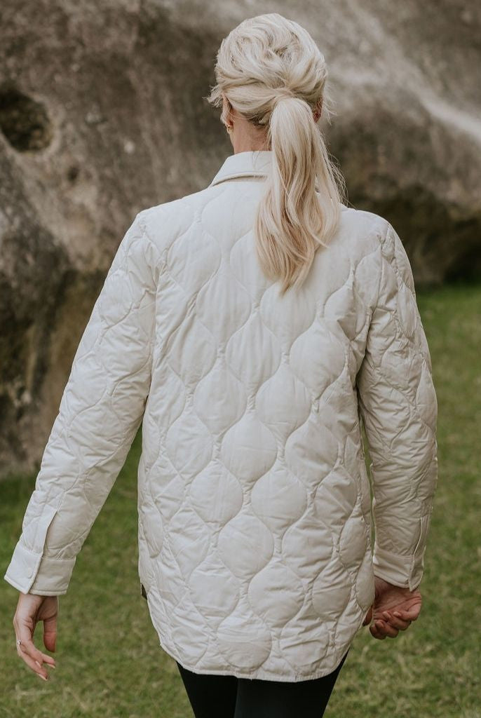 Woman wearing Moke - Ash Down Overshirt in the colour Cream.