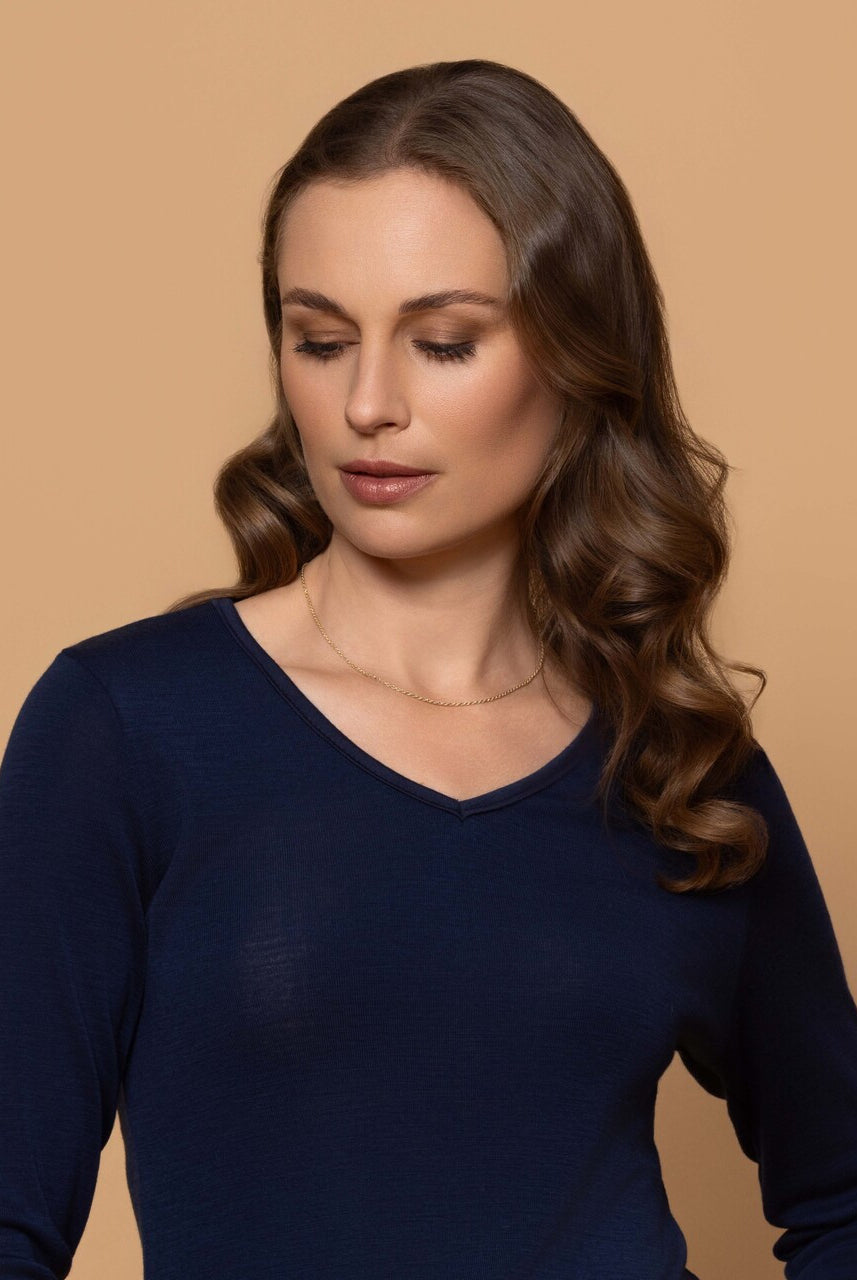 Woman wearing vee neck top in colour Navy