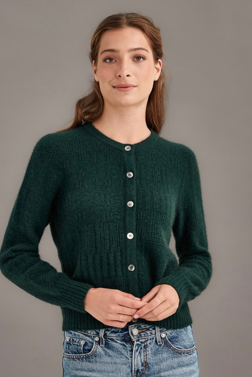 Woman wearing McDonald - Merino & Possum Patchwork Cardigan (5062) in the colour Forest.