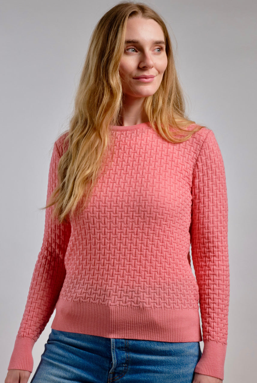 Woman wearing Country Laine - Merino Basketweave Jumper (CL0057) in the colour Peach.