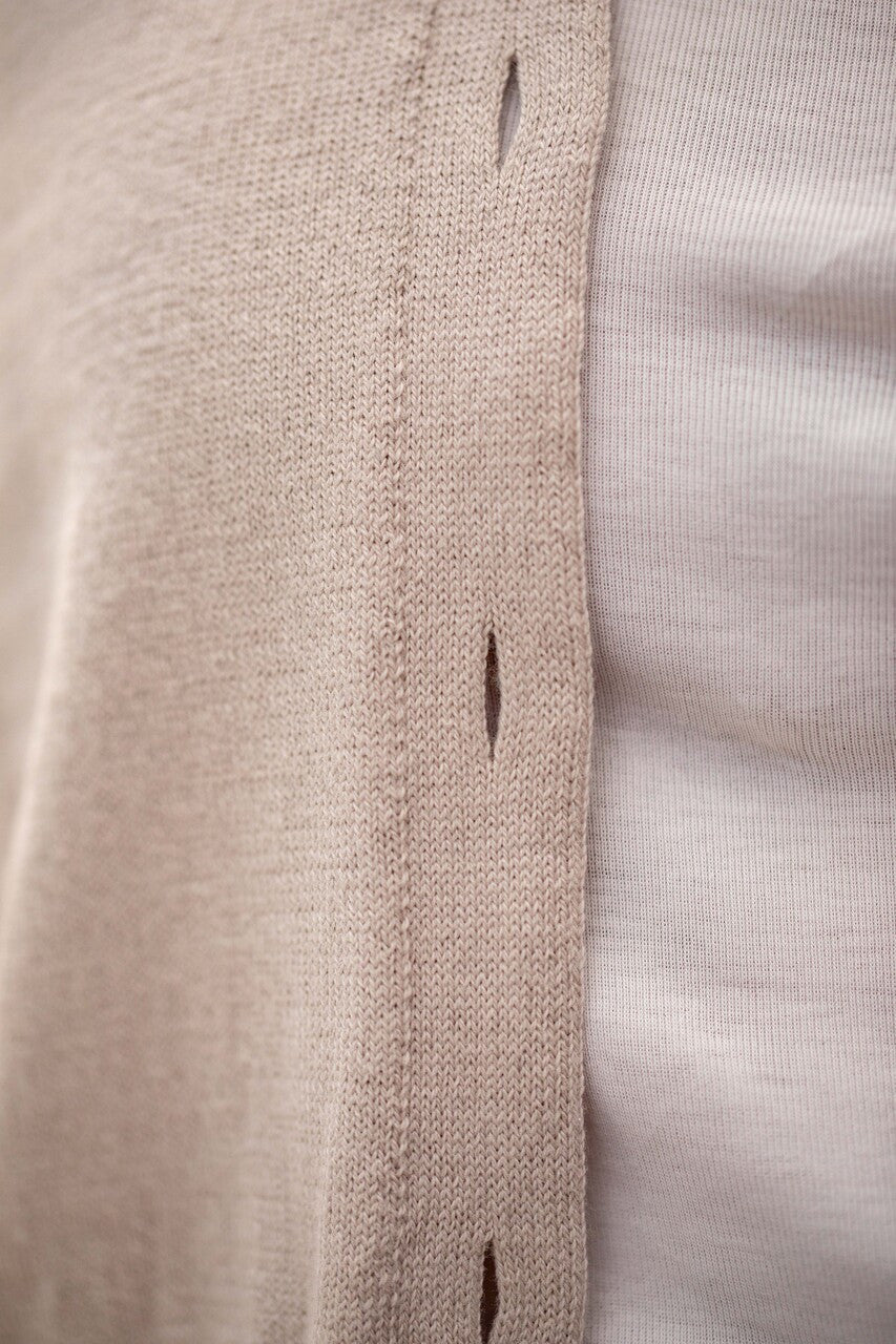 Woman wearing Country Laine - Cotton V Neck Cardigan (CL0093) in the colour Sand.