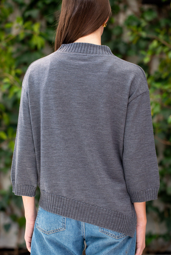 Woman wearing Country Laine - Slant Jumper (CL0115-IND2026) in the colour Dark Grey.