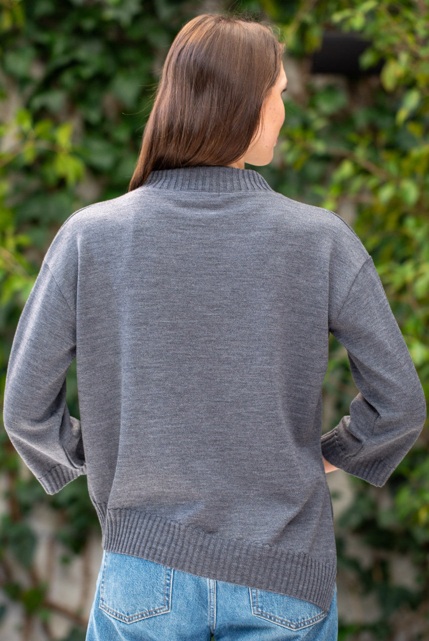 Woman wearing Country Laine - Slant Jumper (CL0115-IND2026) in the colour Dark Grey.