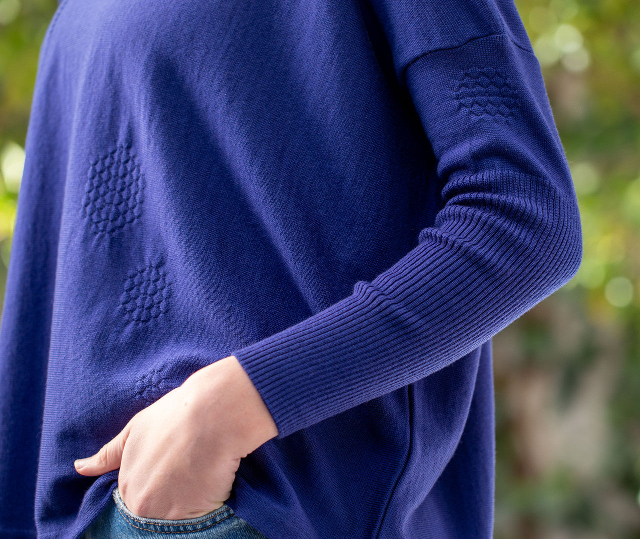 Woman wearing Country Laine - High Neck Sway Jumper (CL0122-IND2026) in the colour Atlantic.