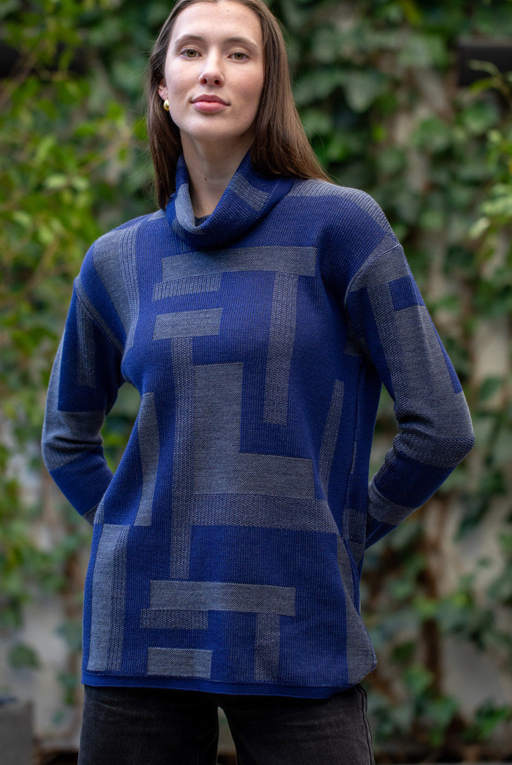 Woman wearing Country Laine - Cubist Jumper (CL0123L-IND2026) in the colour Atlantic/Dark Grey.