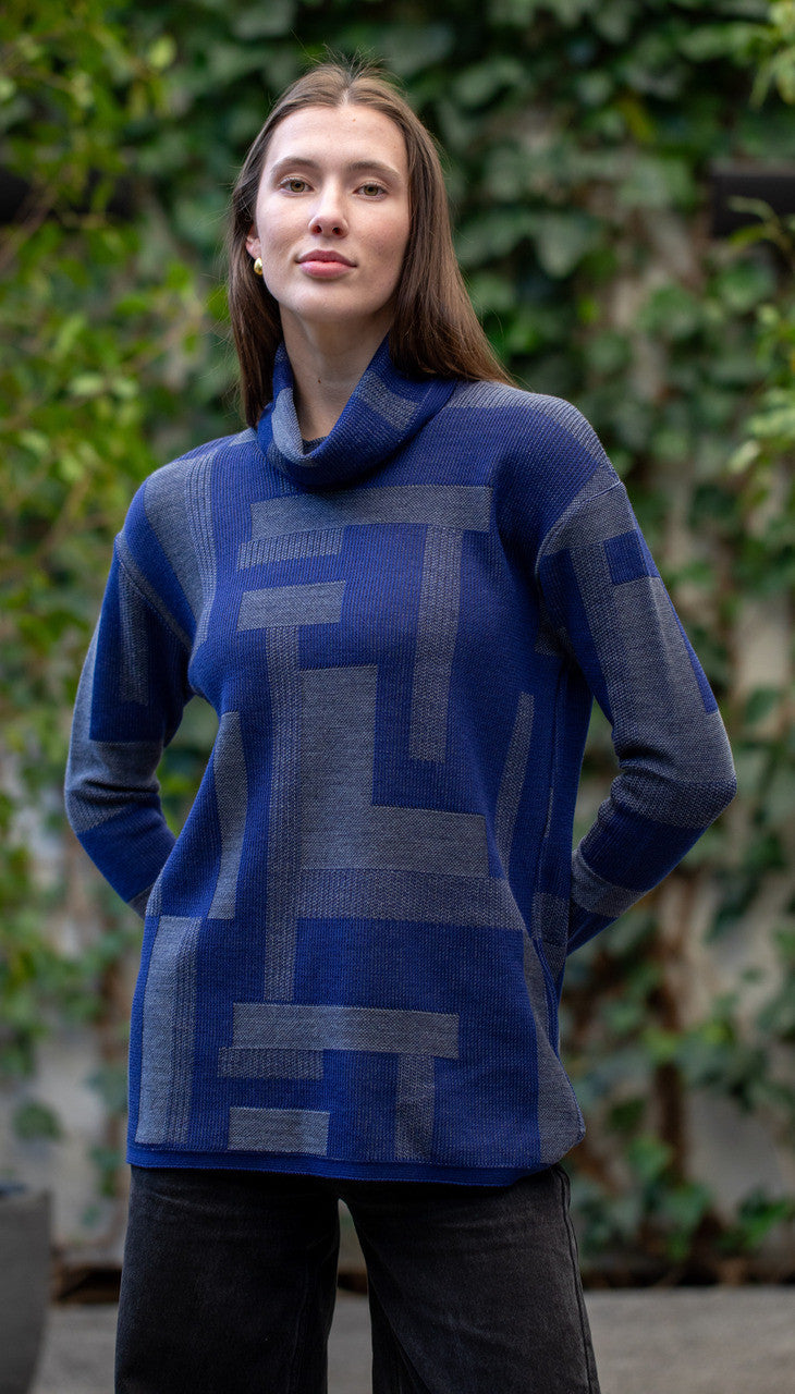 Woman wearing Country Laine - Cubist Jumper (CL0123L-IND2026) in the colour Atlantic/Dark Grey.