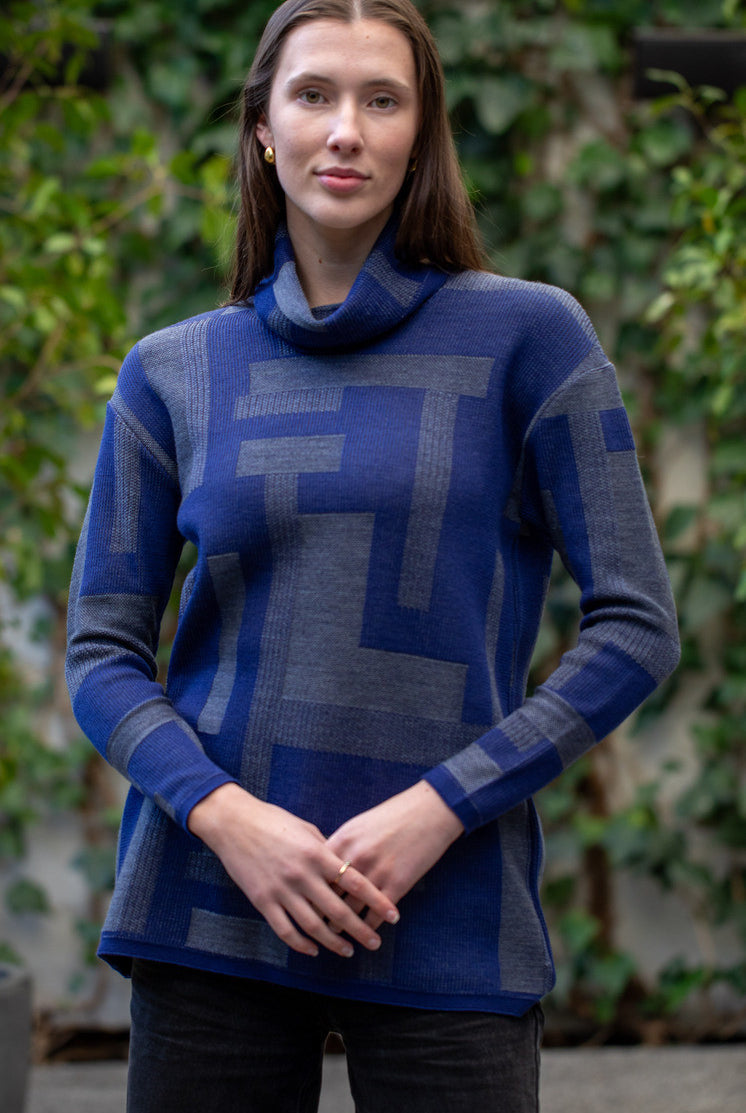 Woman wearing Country Laine - Cubist Jumper (CL0123L-IND2026) in the colour Atlantic/Dark Grey.