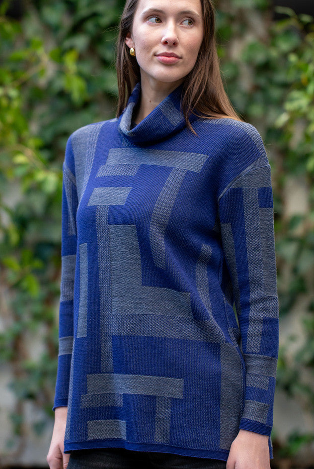 Woman wearing Country Laine - Cubist Jumper (CL0123L-IND2026) in the colour Atlantic/Dark Grey.