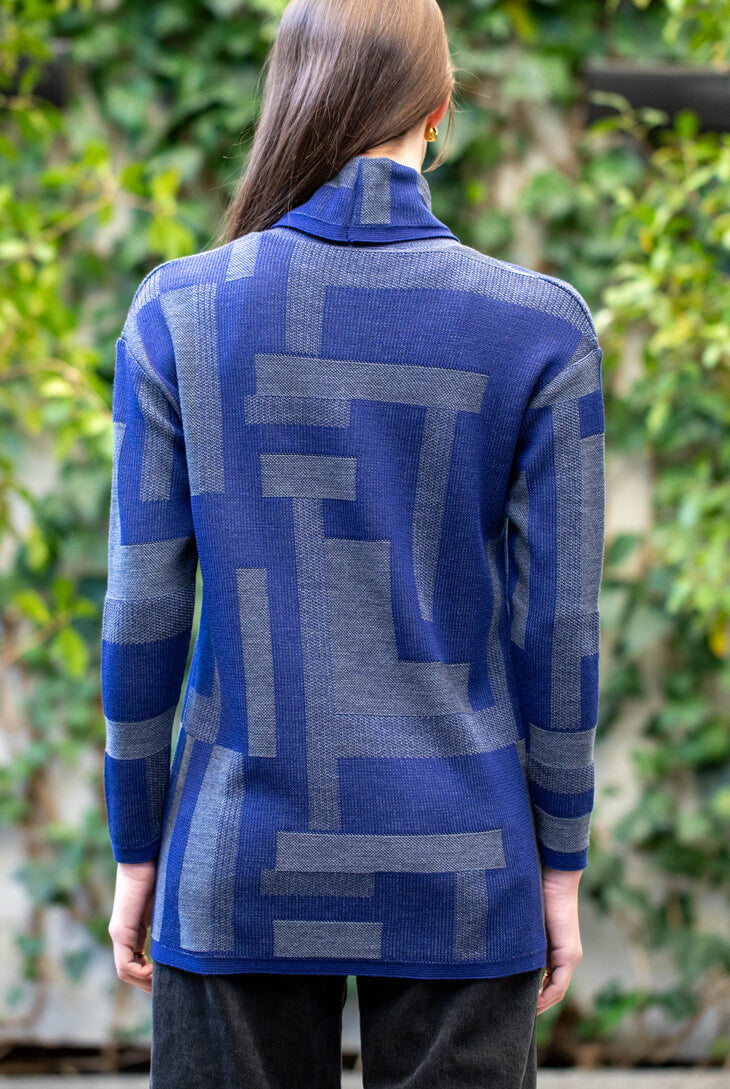 Woman wearing Country Laine - Cubist Jumper (CL0123L-IND2026) in the colour Atlantic/Dark Grey.