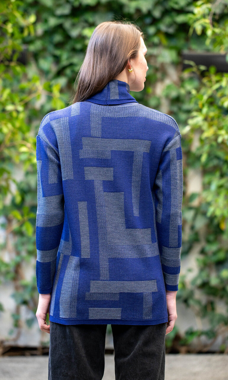 Woman wearing Country Laine - Cubist Jumper (CL0123L-IND2026) in the colour Atlantic/Dark Grey.