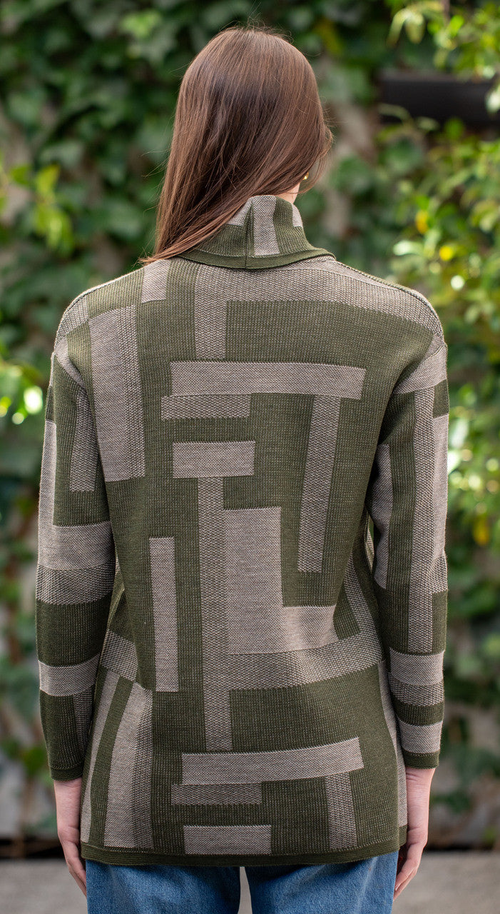 Woman wearing Country Laine - Cubist Jumper (CL0123L-IND2026) in the colour Olive/Chateau.