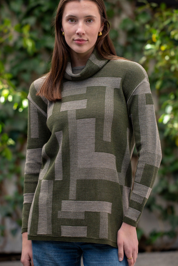 Woman wearing Country Laine - Cubist Jumper (CL0123L-IND2026) in the colour Olive/Chateau.