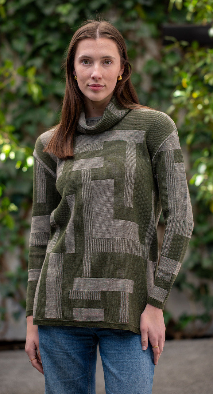 Woman wearing Country Laine - Cubist Jumper (CL0123L-IND2026) in the colour Olive/Chateau.