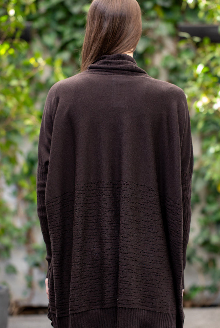 Woman wearing Country Laine - The Nest Top (CL0130-IND2026) in the colour Chocolate.