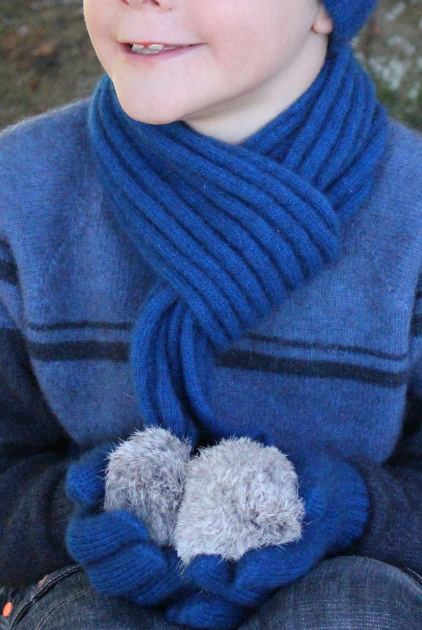 Boy wearing lagoon colour scarf.