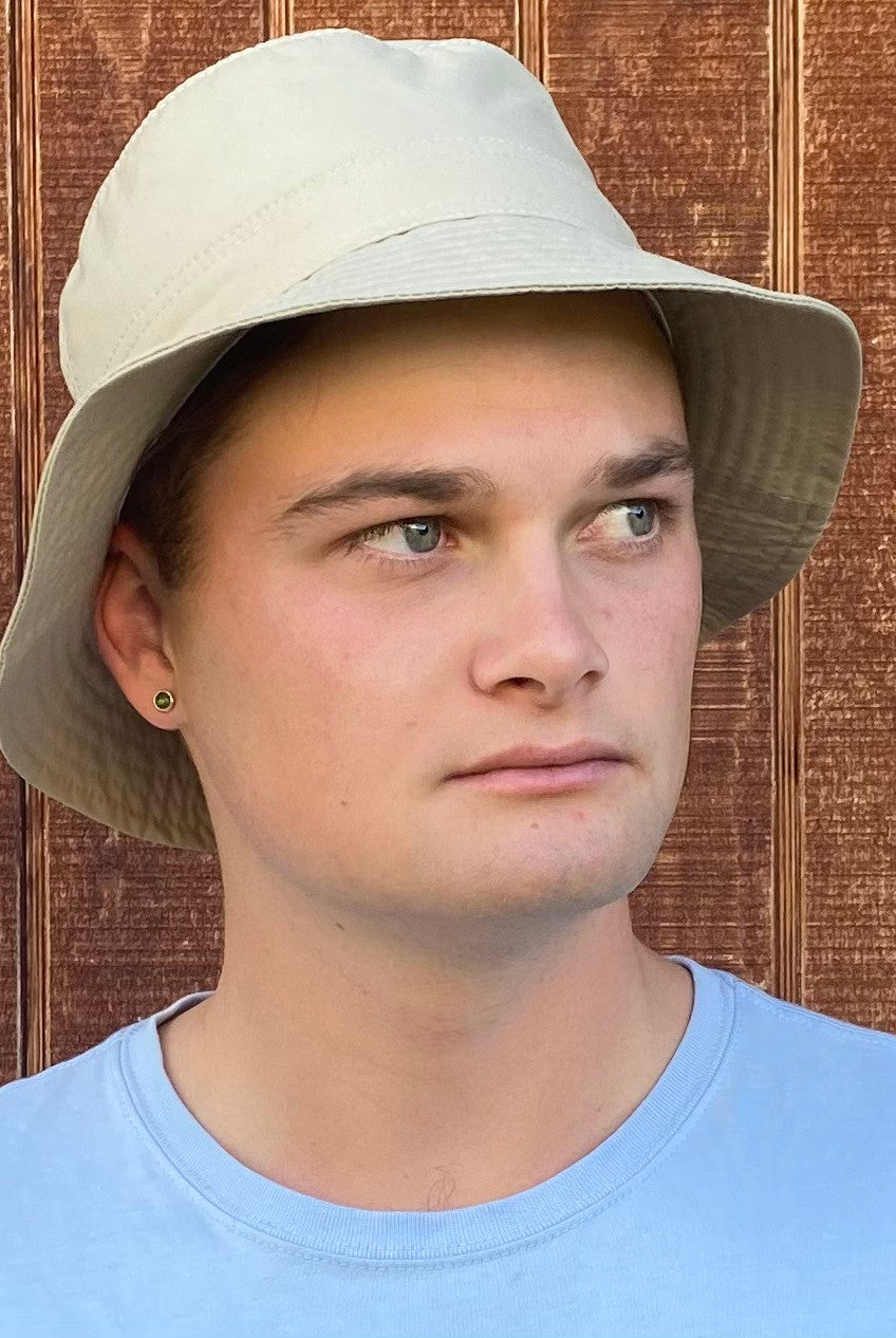 Man wearing light sand coloured Hydroex rain hat.