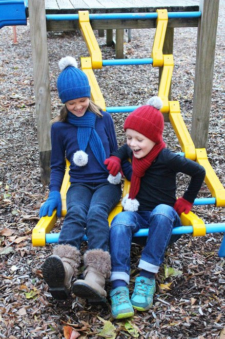 Children in warm wear and beanies. Colour Lagoon & Red