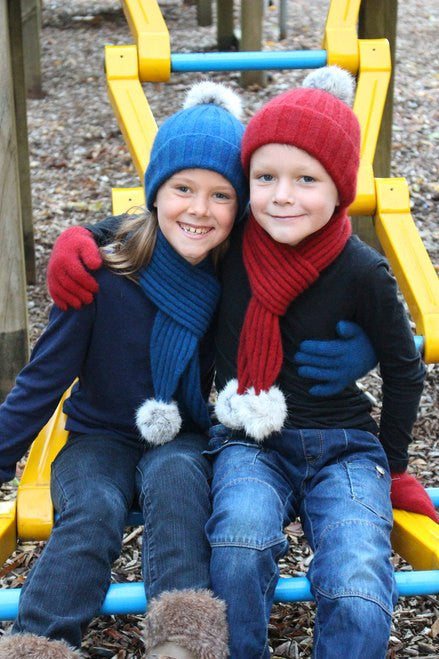 Children in beanies and scarves. Colour Lagoon & Red
