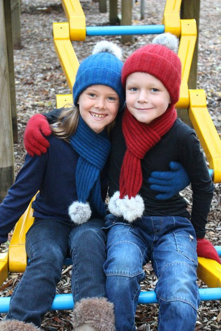 Girl wearing lagoon colour & boy wearing red colour scarf, beanie and glove set.