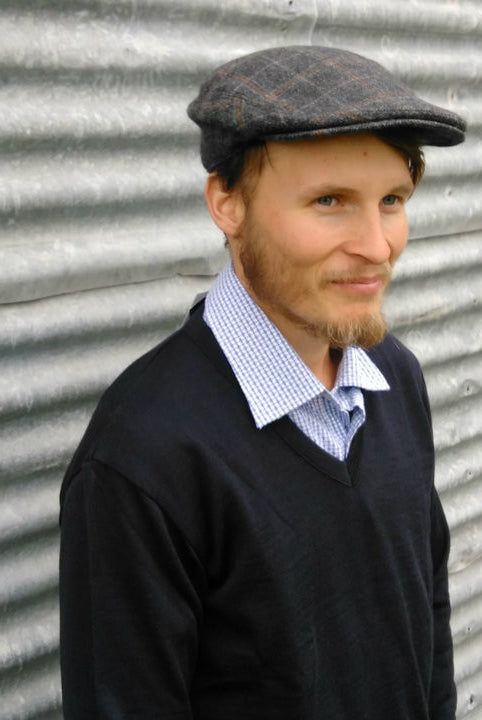 Man wearing hunston black coloured Traditional Cheesecutter Deluxe hat.