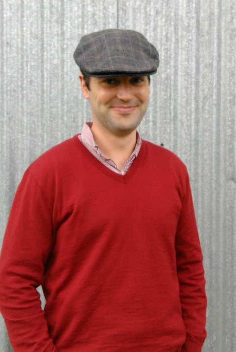 Man wearing Traditional Cheesecutter Deluxe hat in hunston black colour.